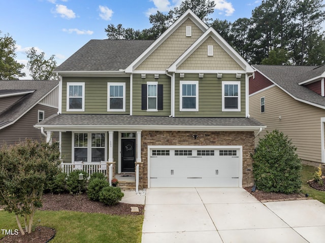 craftsman-style home featuring a garage and covered porch