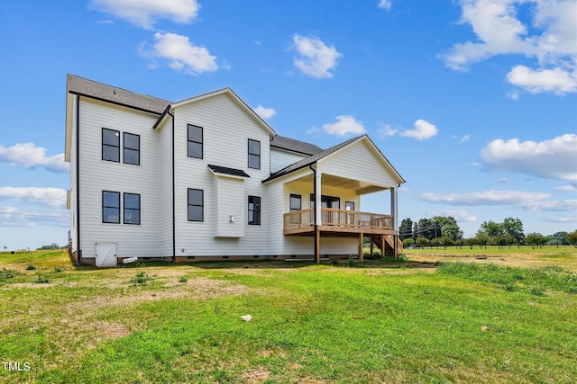 rear view of property with a rural view and a lawn