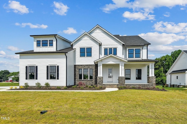 craftsman-style home with a porch and a front yard