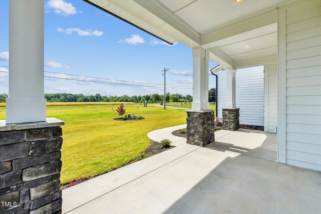 view of patio featuring a porch