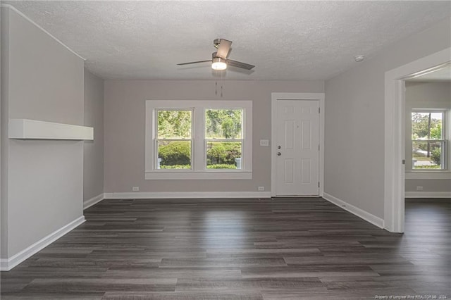 111 Sanford Rd, Laurinburg, NC 28352 - interior space with ceiling fan, a textured ceiling, baseboards, and dark wood finished floors