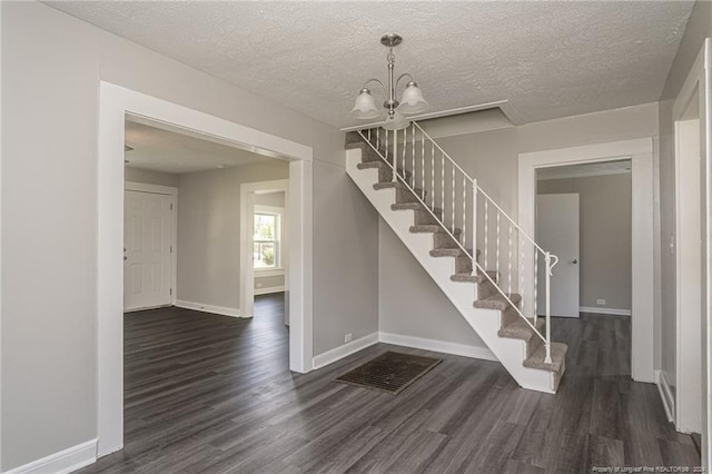 111 Sanford Rd, Laurinburg, NC 28352 - interior space featuring baseboards, stairway, an inviting chandelier, and wood finished floors