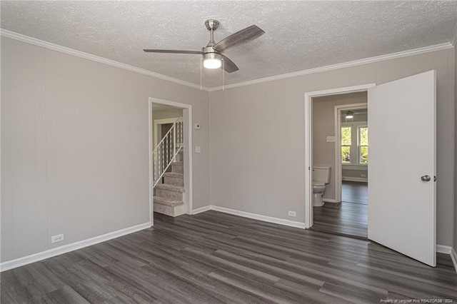 111 Sanford Rd, Laurinburg, NC 28352 - spare room with dark wood finished floors, a ceiling fan, ornamental molding, and a textured ceiling