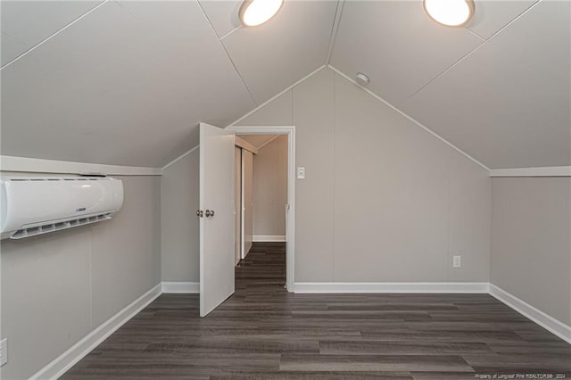111 Sanford Rd, Laurinburg, NC 28352 - bonus room featuring baseboards, vaulted ceiling, a wall mounted air conditioner, and wood finished floors