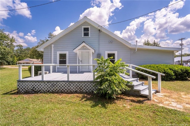 111 Sanford Rd, Laurinburg, NC 28352 - back of house with a deck and a lawn