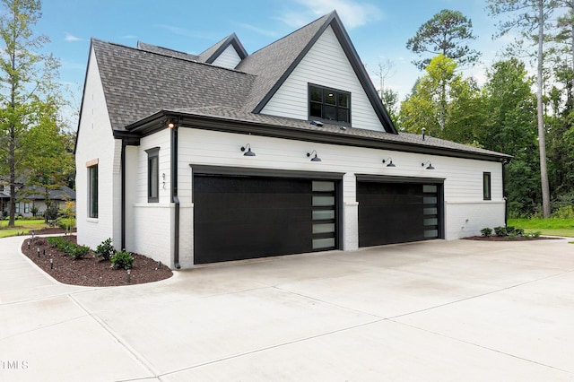 view of side of property featuring a garage