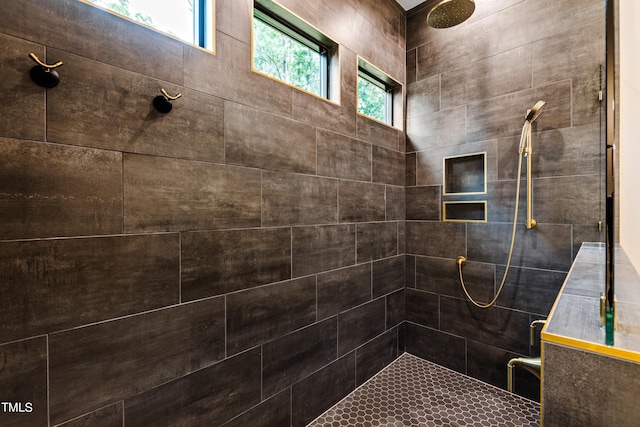 bathroom with tiled shower