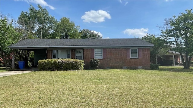 ranch-style house with a front lawn, an attached carport, concrete driveway, brick siding, and crawl space
