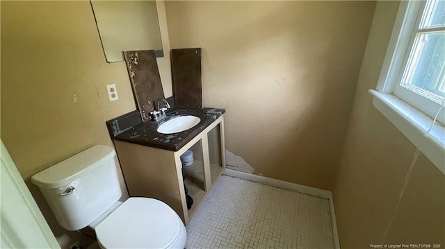 half bath with vanity and toilet