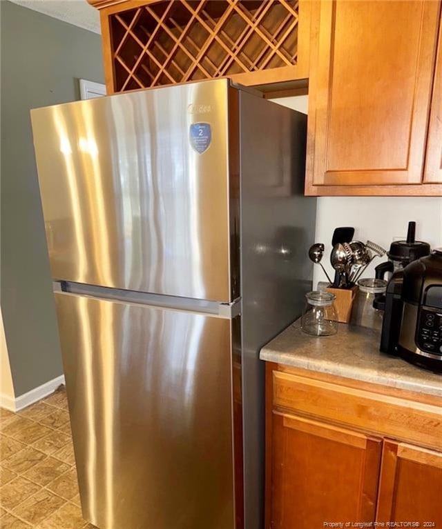 kitchen featuring stainless steel fridge