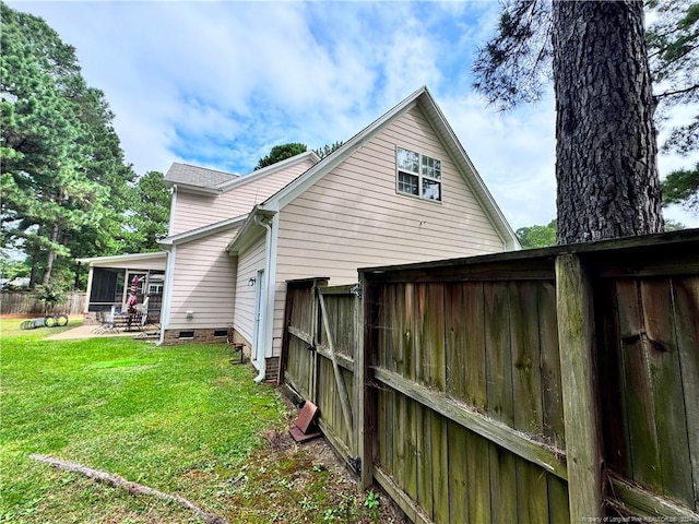 view of home's exterior featuring a patio area and a yard