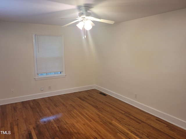 spare room featuring ceiling fan and hardwood / wood-style flooring