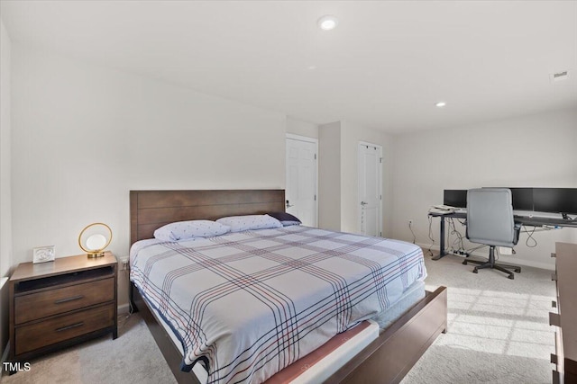 bedroom featuring light carpet