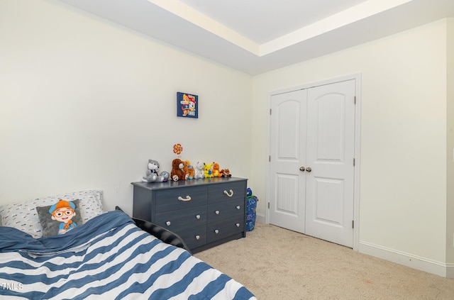 carpeted bedroom with a closet