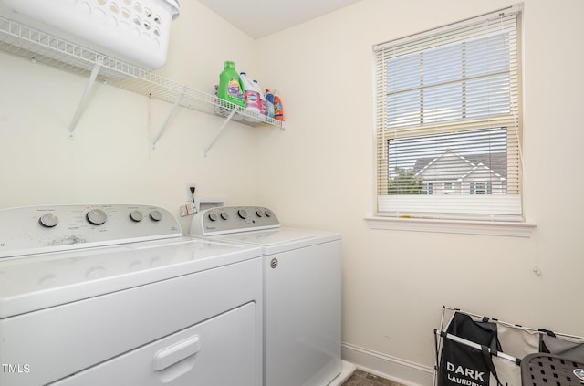 clothes washing area featuring washer and dryer