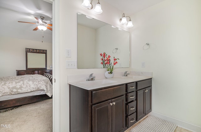 bathroom with ceiling fan and vanity