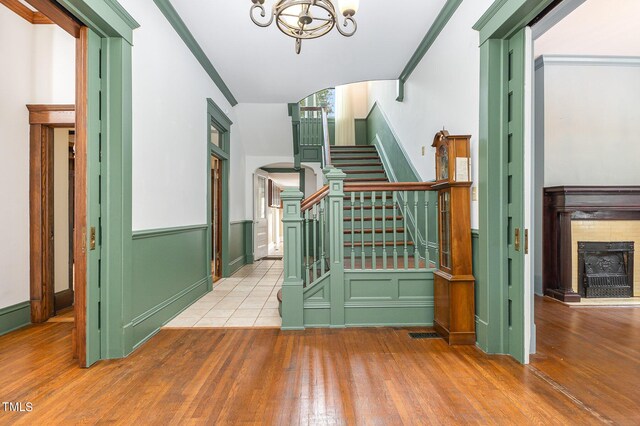 stairway featuring a chandelier and hardwood / wood-style flooring