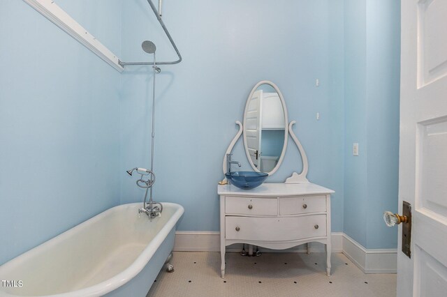 bathroom with vanity and a bathtub