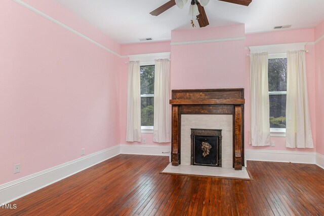 unfurnished living room featuring ceiling fan and wood-type flooring