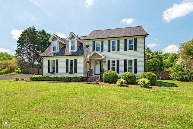 colonial house featuring a front yard