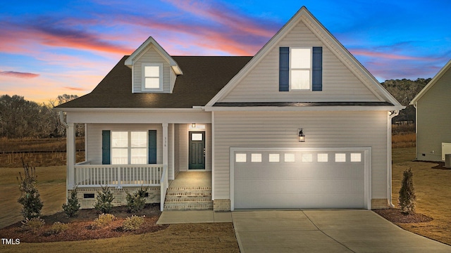 view of front of property featuring central AC unit, a garage, and a porch