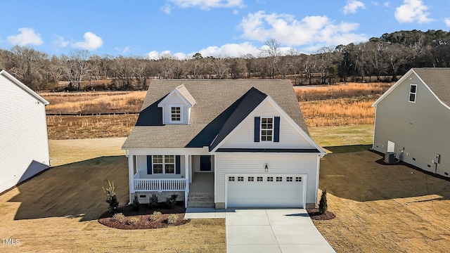 view of front facade with a garage and a porch