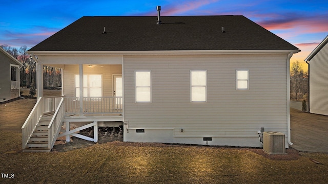 back house at dusk with cooling unit