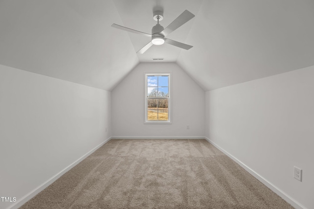 additional living space with light carpet, ceiling fan, and lofted ceiling