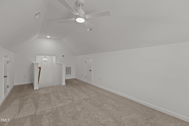 bonus room with ceiling fan, light colored carpet, and lofted ceiling