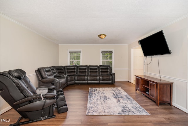 living room with ornamental molding, a textured ceiling, and dark hardwood / wood-style floors