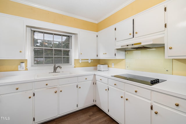 kitchen featuring sink, dark wood-type flooring, white cabinetry, black electric stovetop, and crown molding