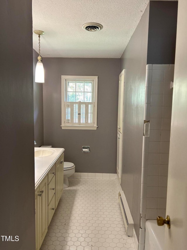 full bathroom featuring vanity, baseboard heating, tile patterned flooring, separate shower and tub, and toilet