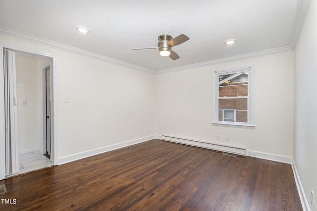 spare room featuring dark hardwood / wood-style flooring, baseboard heating, crown molding, and ceiling fan