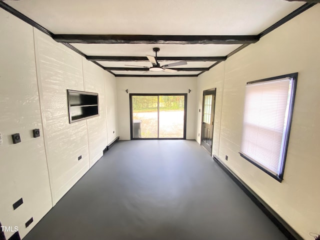 empty room with beam ceiling and ceiling fan