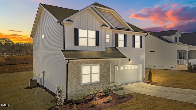 view of front facade with cooling unit and a garage