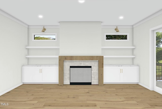 unfurnished living room featuring crown molding, a fireplace, and light hardwood / wood-style floors