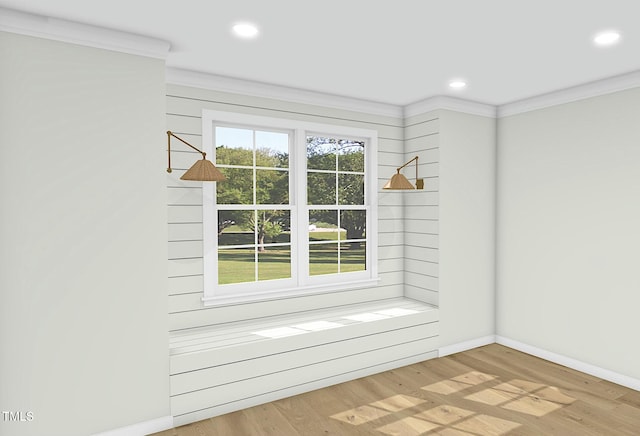 entryway featuring ornamental molding and light hardwood / wood-style floors