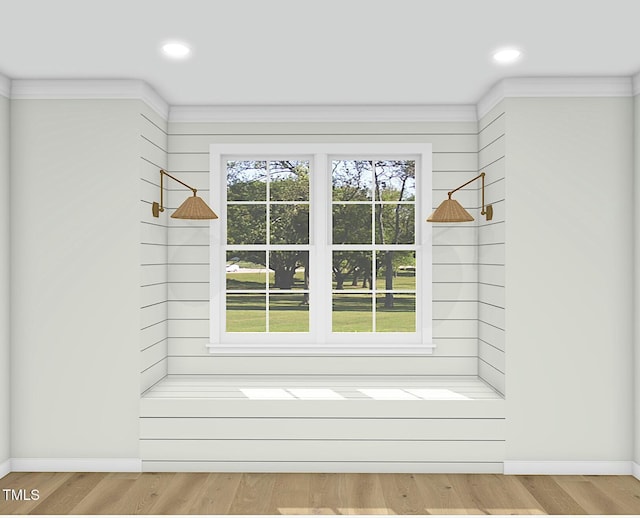 mudroom featuring hardwood / wood-style floors, crown molding, and a healthy amount of sunlight