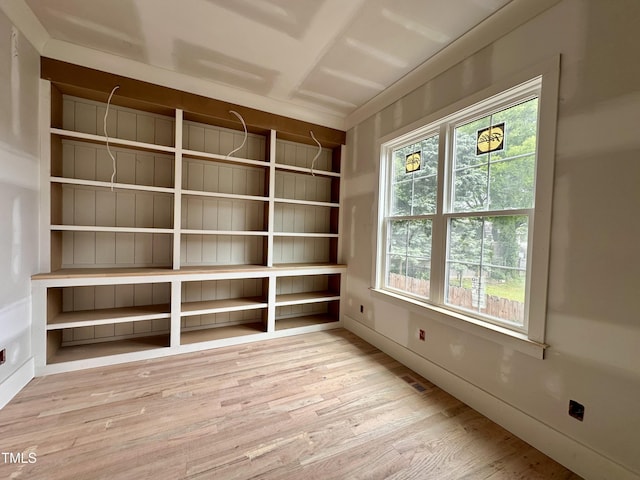 unfurnished room with visible vents and wood finished floors