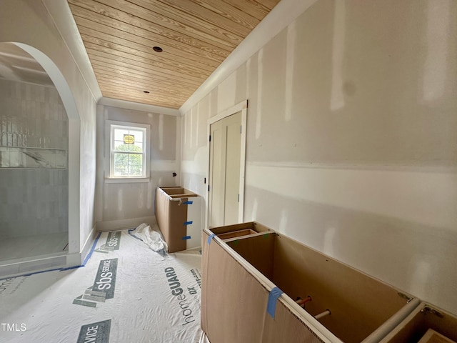 bathroom featuring wooden ceiling and ornamental molding