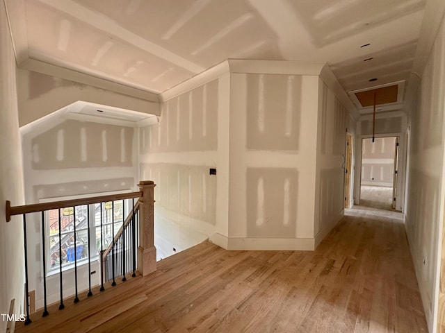 bonus room with attic access and wood finished floors