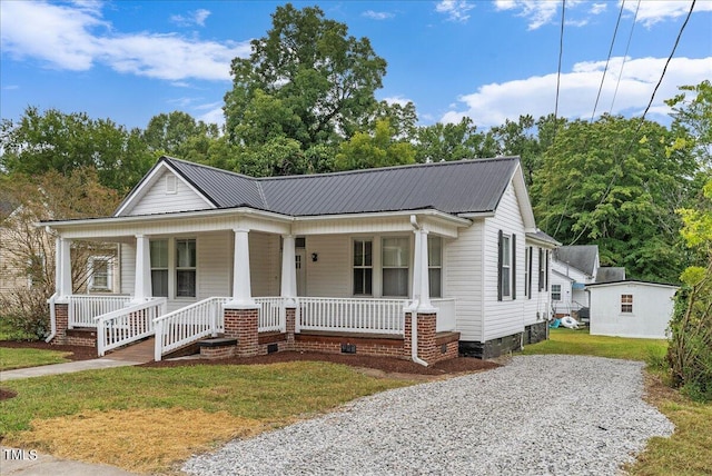 view of front of home featuring a front lawn and a porch