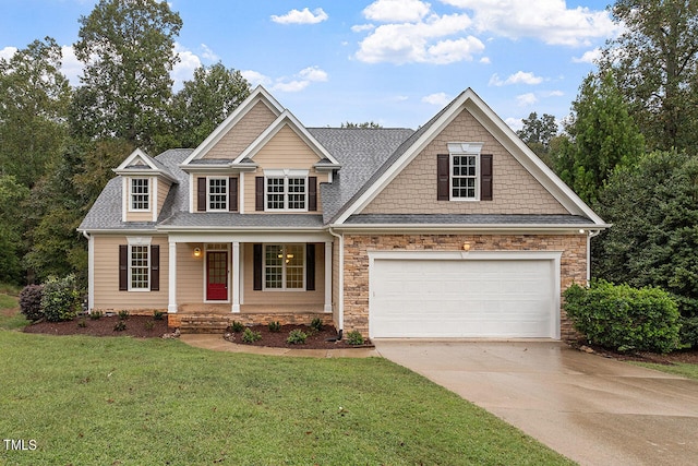 craftsman house featuring a front lawn, covered porch, and a garage