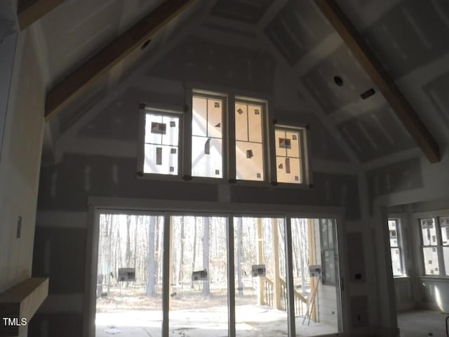 doorway to outside with lofted ceiling