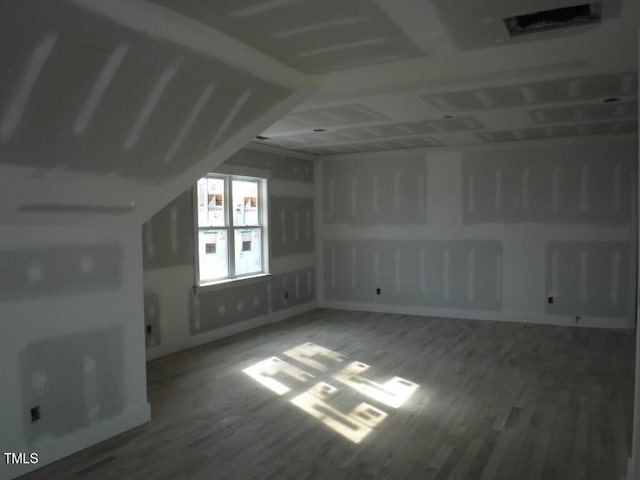 bonus room featuring hardwood / wood-style floors and vaulted ceiling