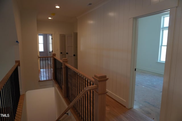 hallway featuring light wood finished floors, recessed lighting, an upstairs landing, and baseboards