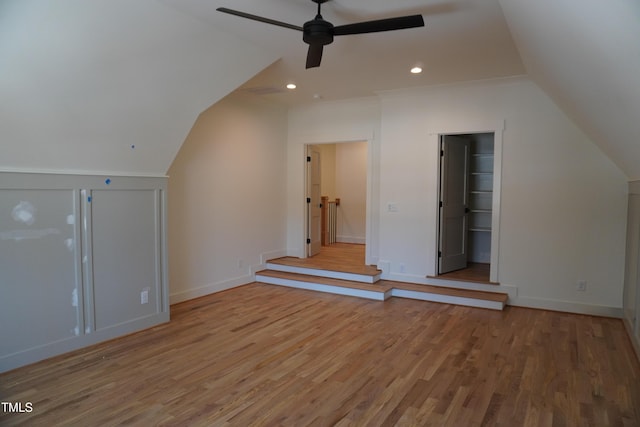 bonus room featuring light wood finished floors, lofted ceiling, recessed lighting, ceiling fan, and baseboards