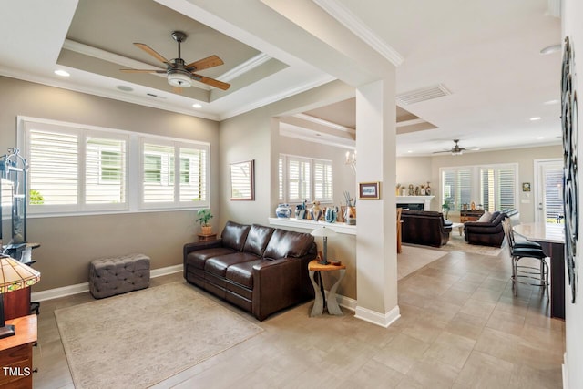 108 Boone St, Chapel Hill, NC 27516 - living area featuring a ceiling fan, baseboards, a tray ceiling, visible vents, and ornamental molding