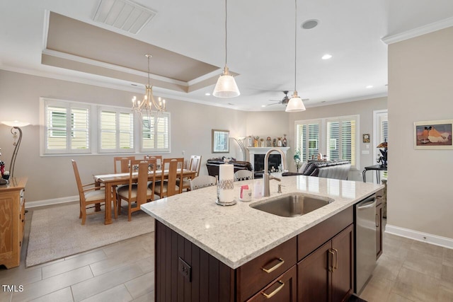 108 Boone St, Chapel Hill, NC 27516 - kitchen with dark brown cabinetry, visible vents, a fireplace, a sink, and ceiling fan with notable chandelier