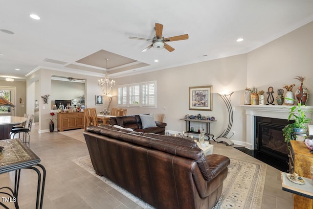 108 Boone St, Chapel Hill, NC 27516 - living area featuring crown molding, a fireplace with flush hearth, ceiling fan with notable chandelier, and a healthy amount of sunlight
